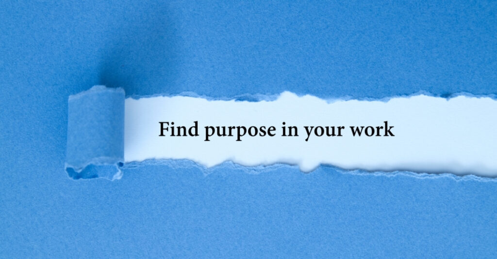 "Torn blue paper revealing the phrase 'Find purpose in your work' in bold text on a white background." Buying a Business