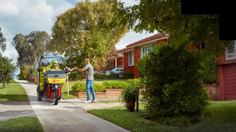 photo-postie-driving-electric-vehicle-delivering-mail-to-man-1.jpg.auspostimage.760_0.169.medium-1.jpg