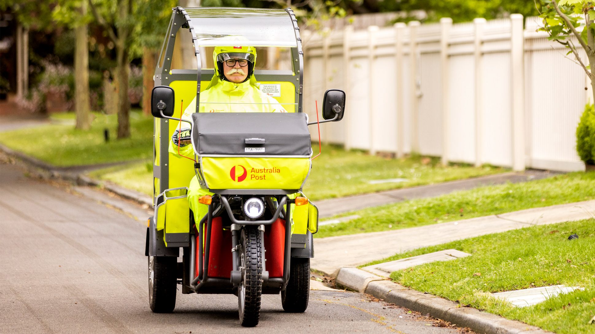 photo-postie-driving-electric-vehicle-on-road-1.jpg.auspostimage.1940_0.medium1-1.jpg