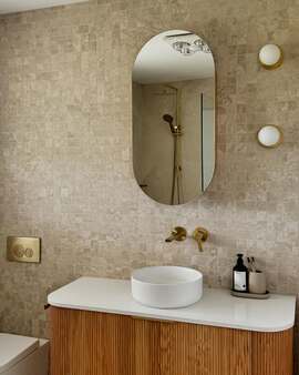 This-bathroom-glow-up-by-dellabarratt-is-dreamy-Della-chose-our-Pompeii-Travertine-tile-in-the-600x600-size-and-square-mosaic-format-on-this-feature-wall-1