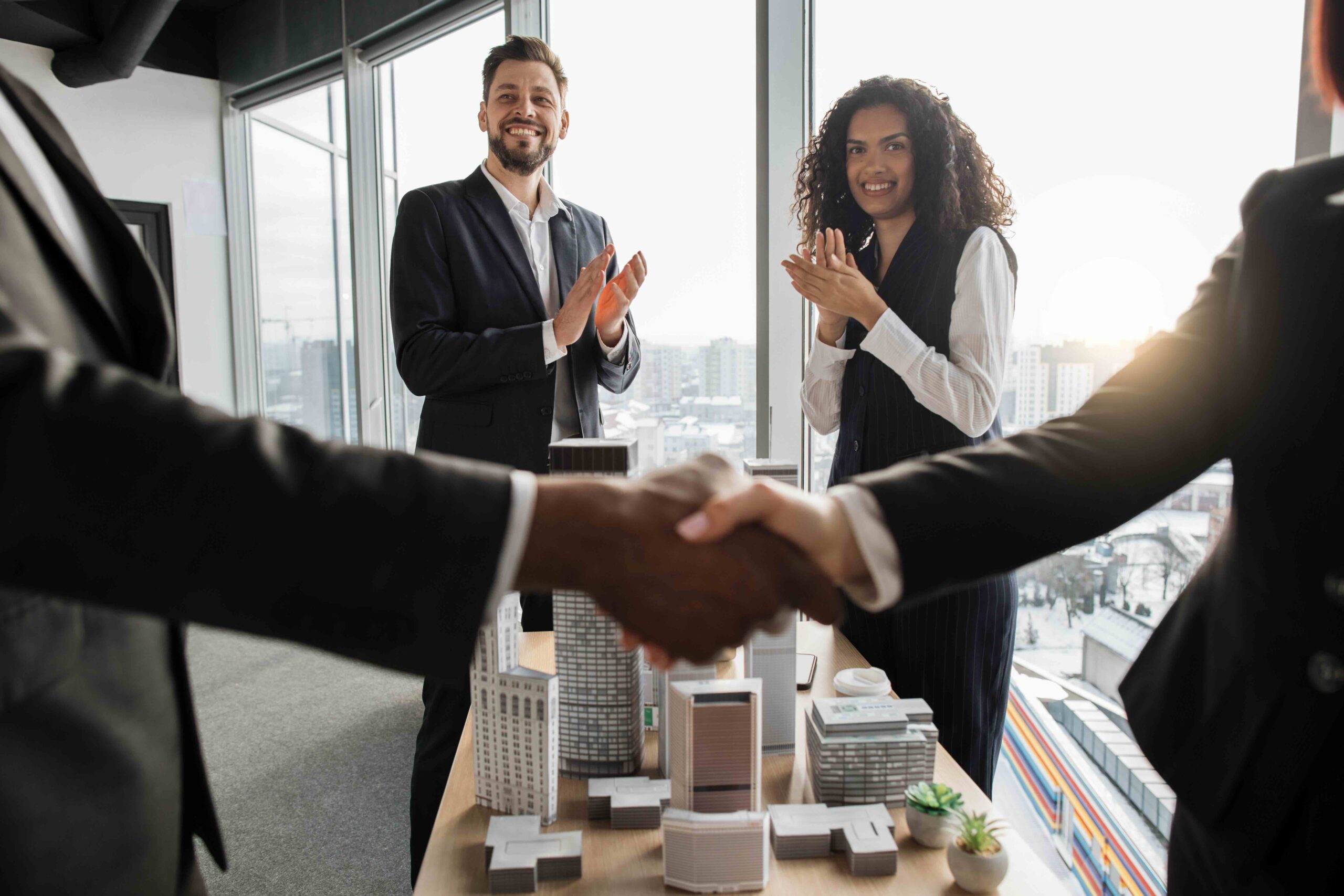 Selective focus on two business people applauding
